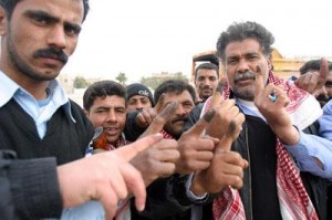 Iraqi voters show inked fingers. CC license: Wikimedia