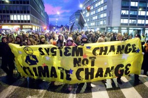 Banner at UN Climate Change conference in Copenhagen; photo via Flickr by kris krug 