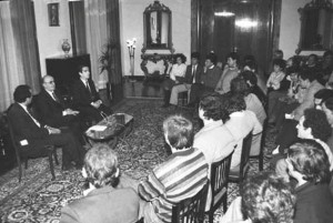 Albanian communist party head Ramiz Alia, center, meeting students on December 11, 1990, to announce the legalization of political parties. (c) ATA
