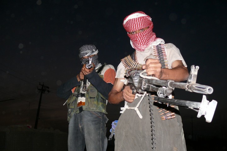 Iraqi insurgents with guns