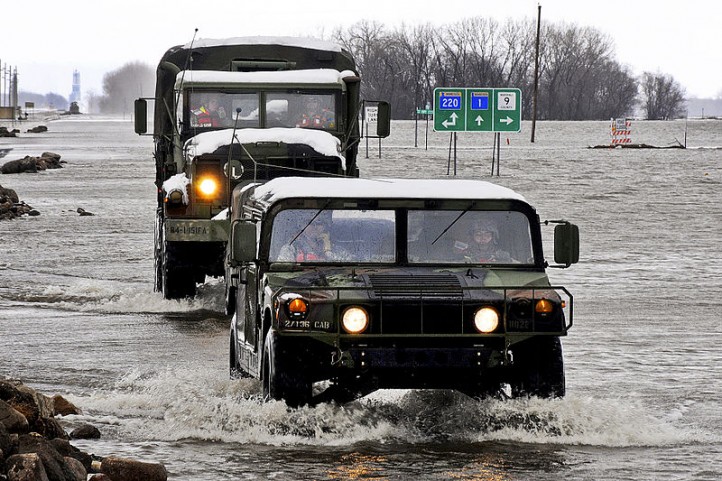 800px-National_Guard_trucks_ford_flood_in_Minnesota