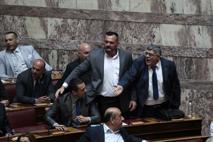 Golden Dawn is tied to wealthy shipping owners, the National Intelligence Service, and municipal police departments. Pictured: far-right (excuse pun), Golden Dawn leader Nikolaos G. Michaloliakos. (Photo: JailGoldenDawn)