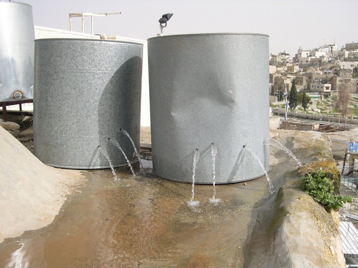 Palestinian water tanks vandalized by Israeli settlers in Hebron. (Photo: ISM Palestine / Flickr)