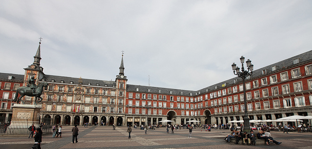 Spain’s woes began with the American banking crisis of 2007-08, which crashed Spain’s vast real estate bubble and threatened to bring down its financial system. Pictured: Plaza Mayor, Madrid. (Photo: Rick Ligthelm / Flickr Commons)