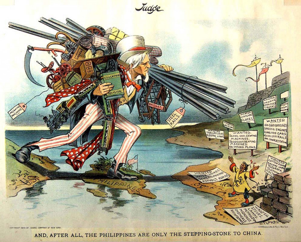 A Cartoon Uncle Sam carrying weapons, books, and supplies strides toward the Philippines, circa 1900. (Wikimedia commons)