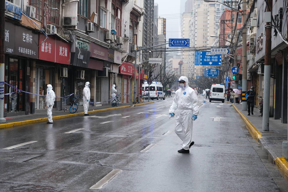 Medical staff wearing hazmat suits walk through Shanghai during a January 2021 lockdown. (Shutterstock)