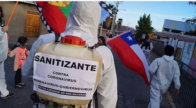 "Sanitizer against coronavirus, the mining virus, and the government virus. These killers won't kill us." March in Putaendo, Chile. (Photo: Putaendo Resiste)
