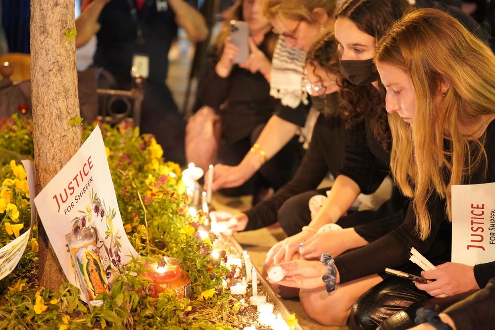 Mourners hold a vigil for the slain Palestinian American journalist Shireen Abu Akleh outside the National Press Club in Washington, D.C. (Shutterstock)