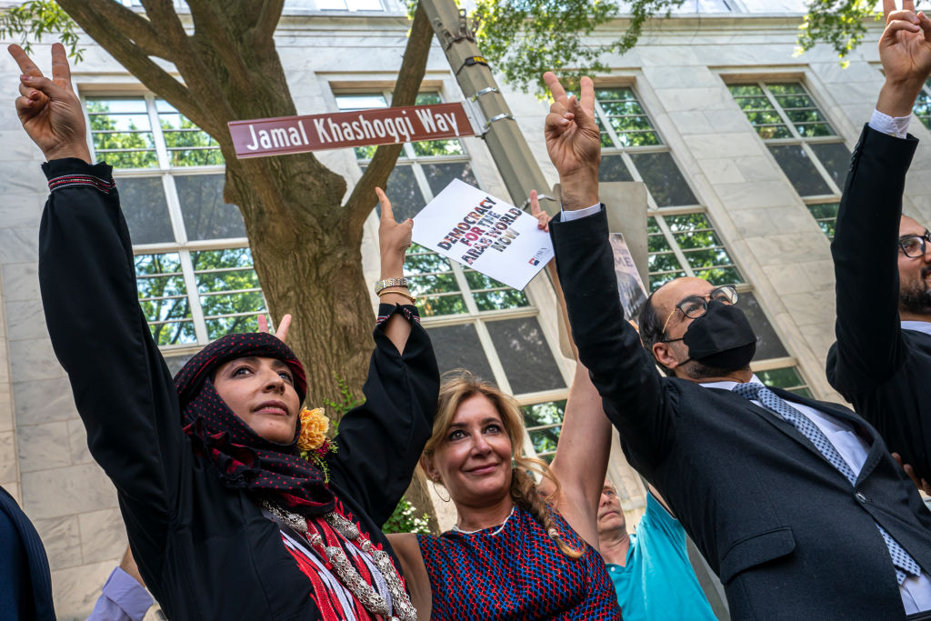 Human rights activists celebrate during an event to rename the street outside the outside the Saudi embassy to Jamal Khashoggi Way in Washington, DC, June 2022. (Nathan Howard/Getty Images)