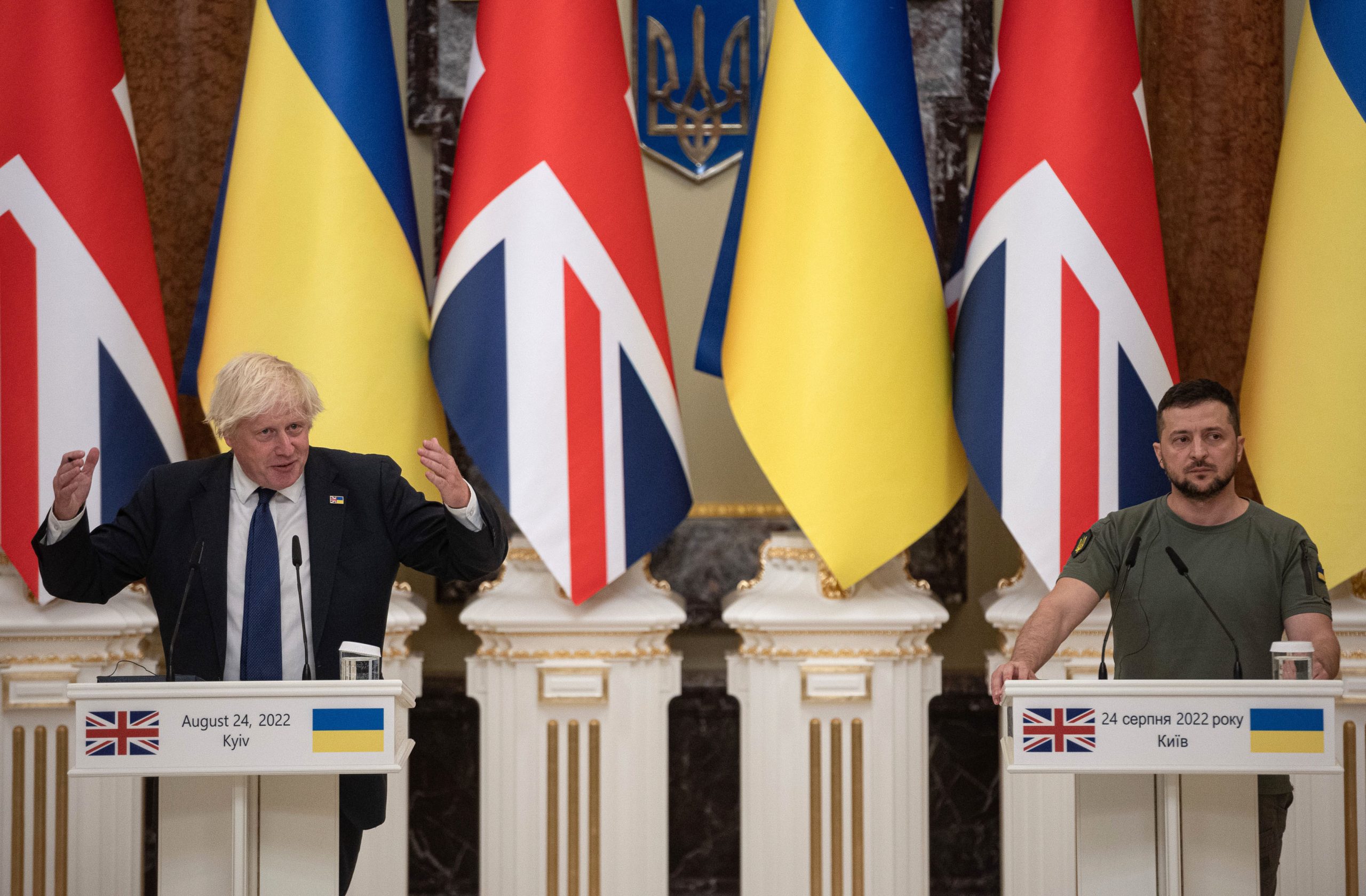 Ukrainian President Volodymyr Zelensky (R) listens to British Prime Minister Boris Johnson as they give a press conference on August 24, 2022 in Kyiv, Ukraine. (Photo by Alexey Furman/Getty Images)