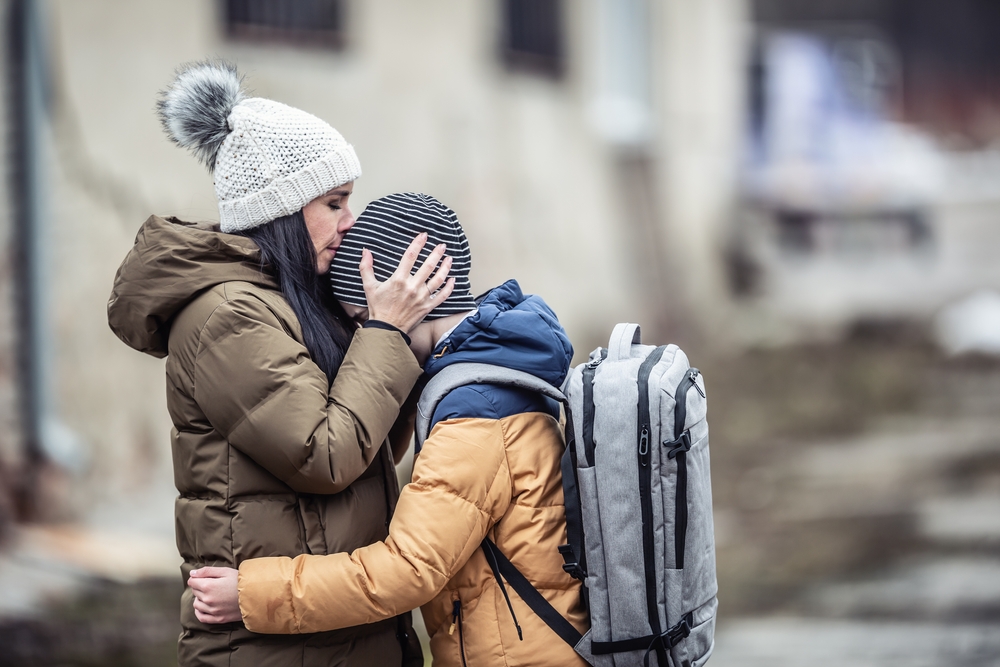 A mother comforts a child, Ukraine (Shutterstock)
