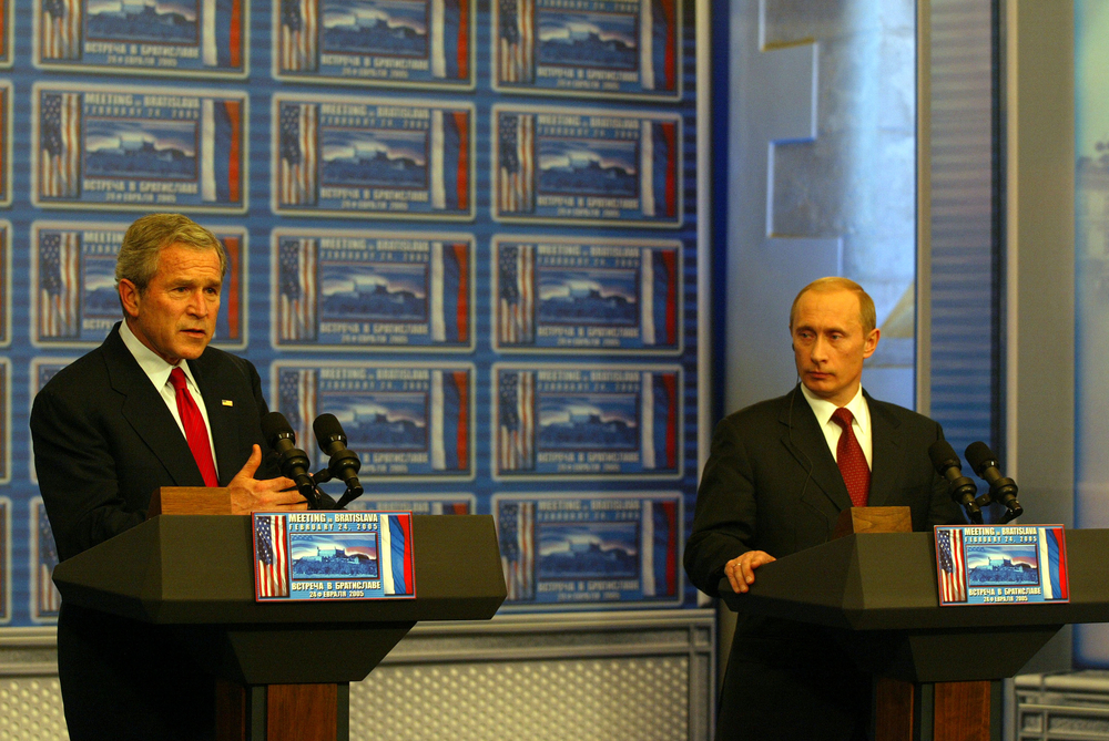 George W. Bush and Vladimir Putin address reporters together in Bratislava, Slovakia, 2005. (Shutterstock)